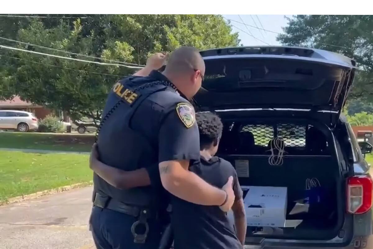 Police officer surprises a young job seeker with a PlayStation 5