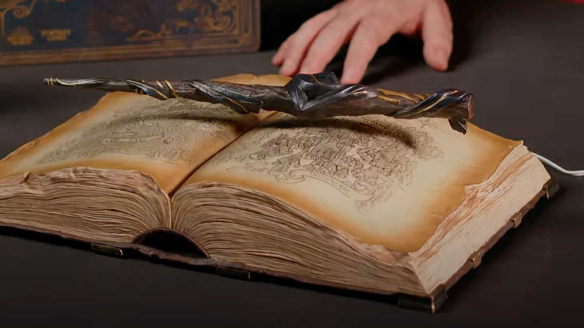 The collection includes a full-scale magic wand that floats above the book!